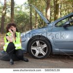 stock-photo-woman-punctured-her-car-and-phone-for-help-588592139